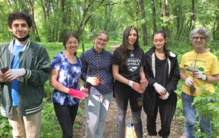 CRC restoration volunteers with trees for planting